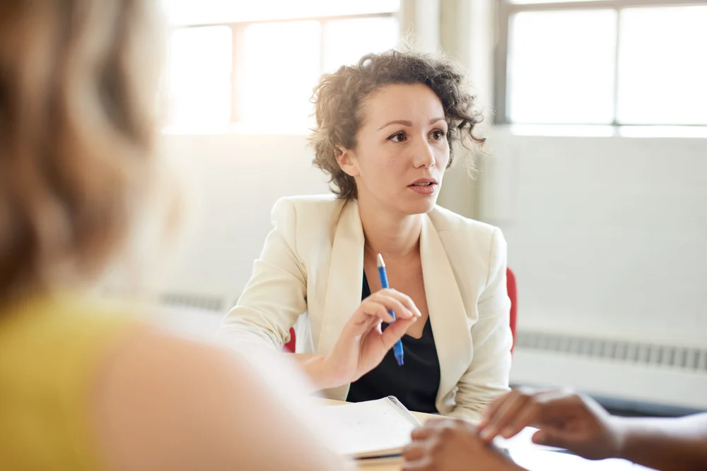 financial advisor talking to clients after selling practice